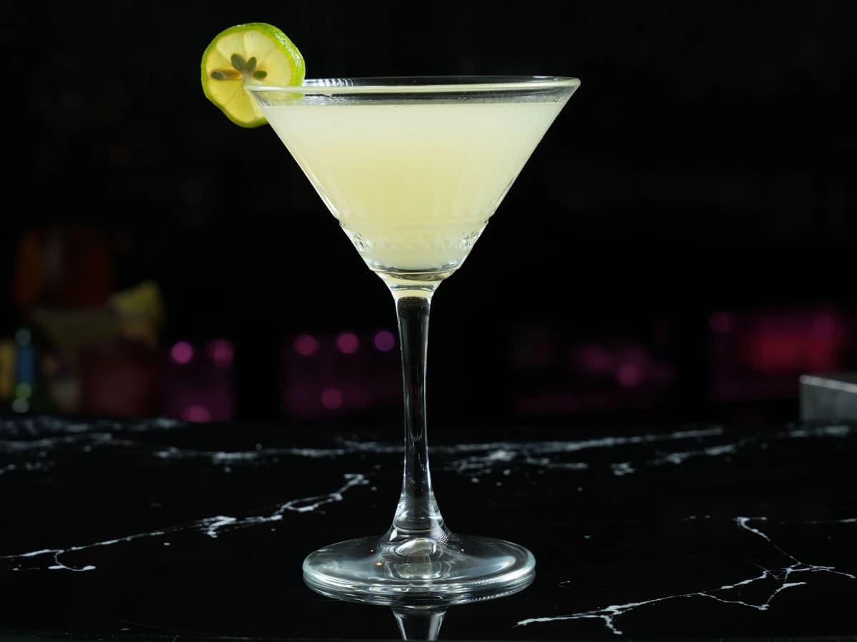 A Daiquiri in a chilled coupe glass with a lime wheel
