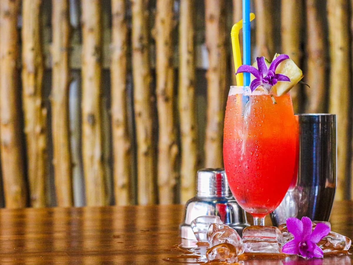 Sex on the Beach in a highball glass with an orange slice and cherry