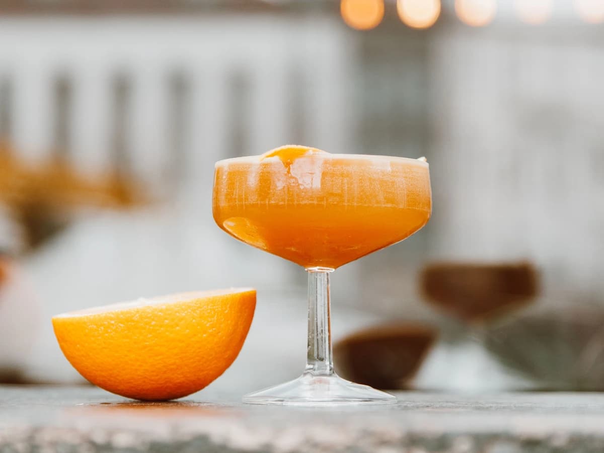 A Sidecar in a sugar-rimmed coupe glass with an orange twist