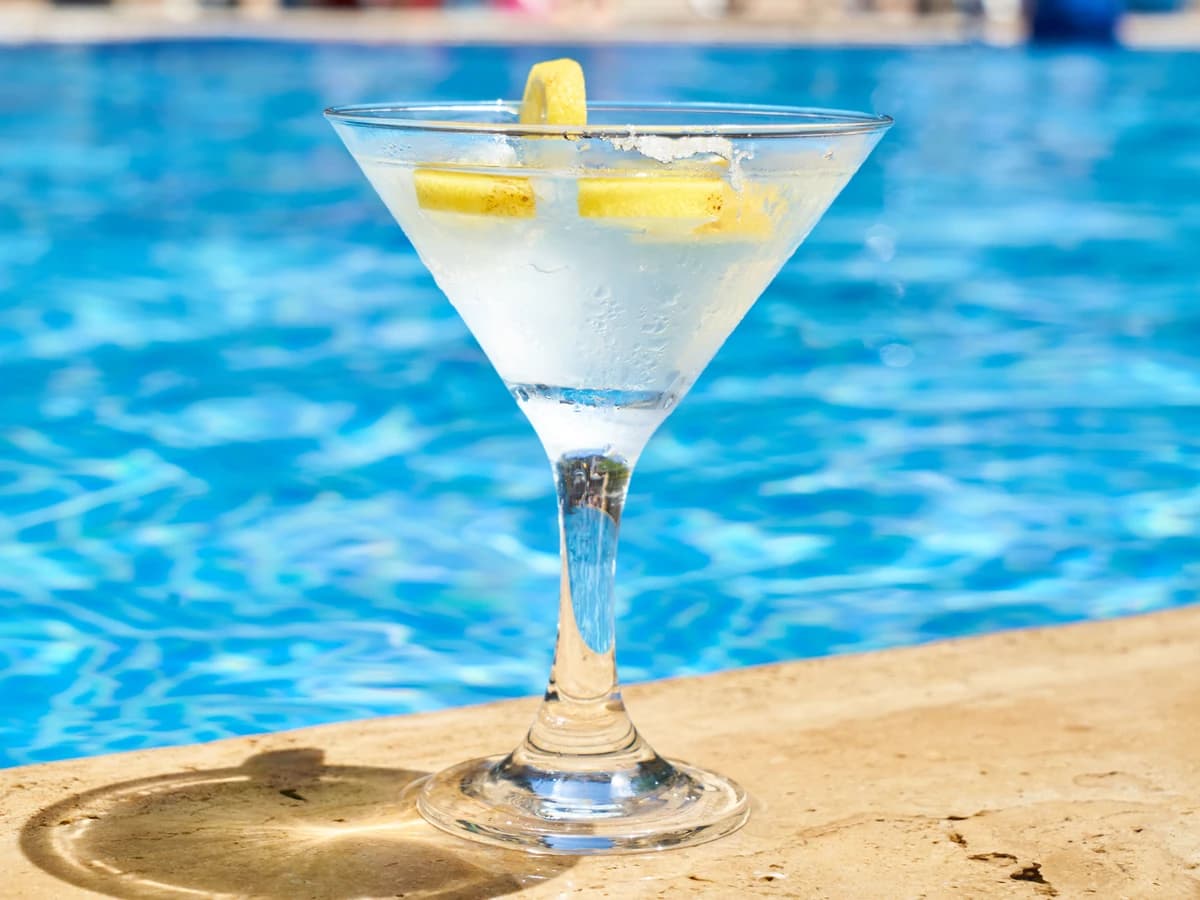 A Vesper cocktail in a chilled glass with a lemon twist