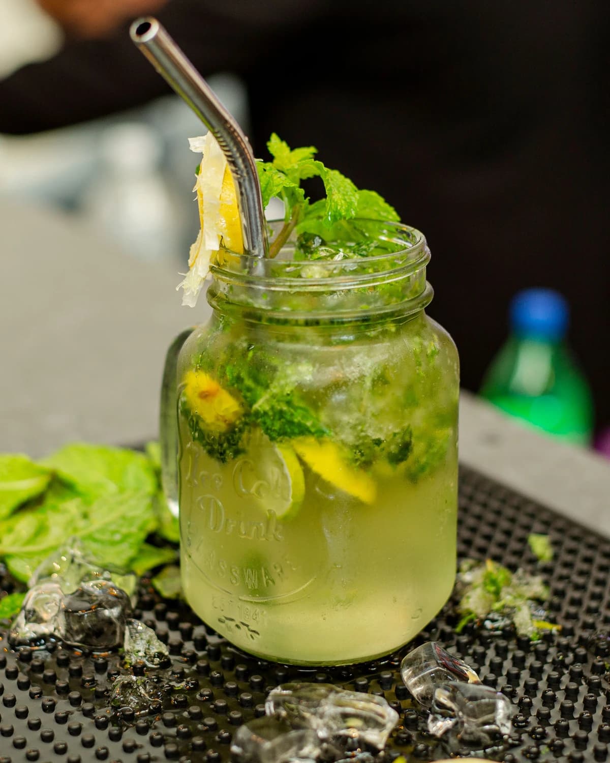 A tall alcohol-free mojito with mint and lime in a highball glass