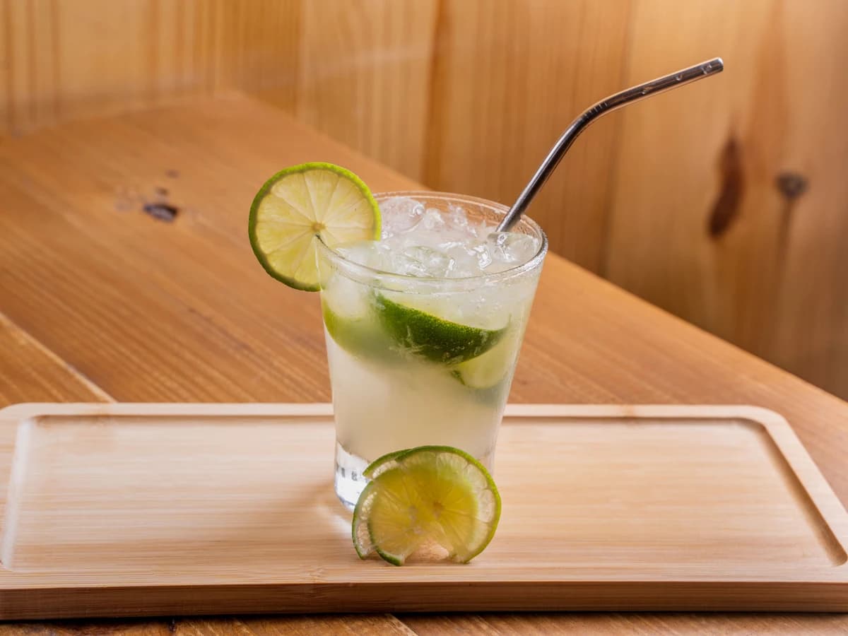 A Vodka Soda in a highball glass with a lime wedge